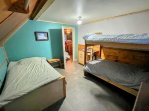 bedroom with single bed bunkbeds and a double bed and sink